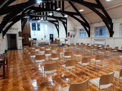 A room with tables and chairs

Description automatically generated with low confidence